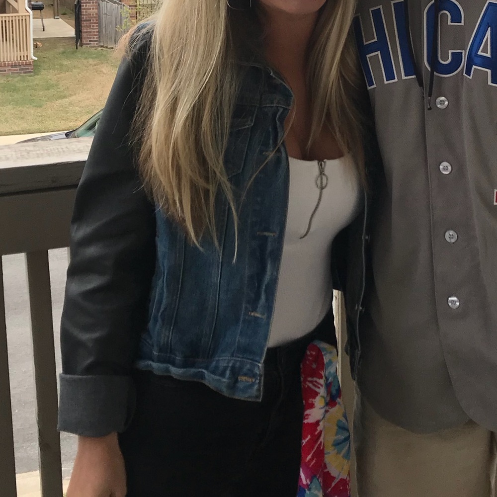 Denim jacket with leather sleeves